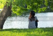 Young Woman Sitting River Bank Under Tree Head Her Wear Headphone Fullside Listening Music Public Garden 88059351 220x150